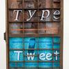 "From Type to Tweet" -  For an exhibit titled "The Writing's on the Wall" - A letterpress drawer and paper illustrate breakthroughs in communication technology from the invention of the printing press in the 1400's to the use of Twitter today
